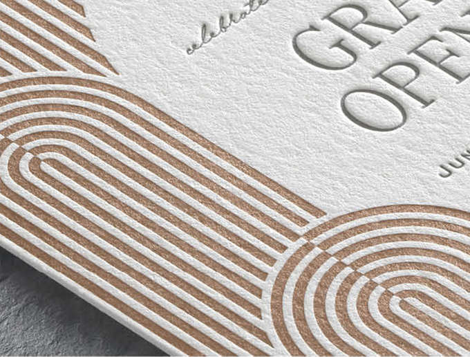 Closeup image of a contemporary arch design in copper and gray letterpress on a custom invite