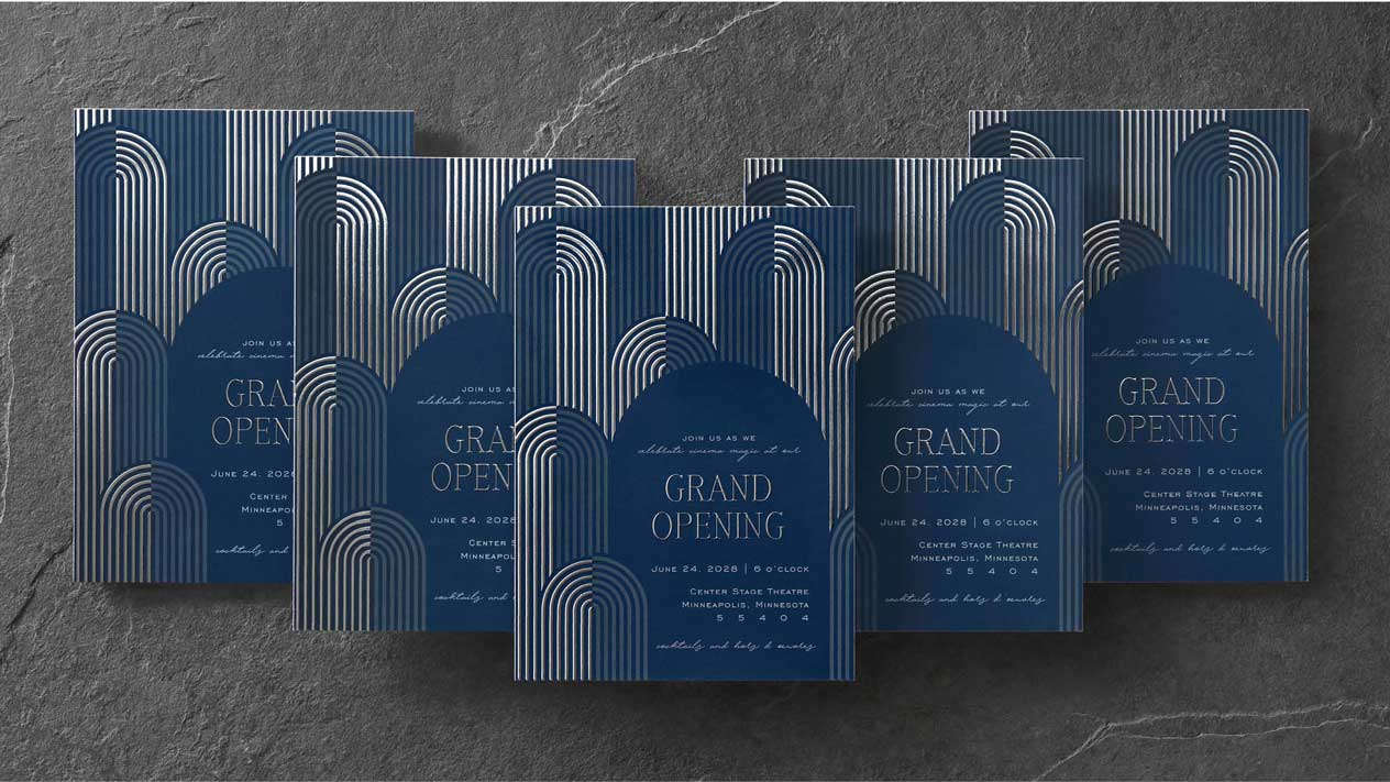 Five custom event invitations with silver enhanced foil on a navy background stacked in a V formation
