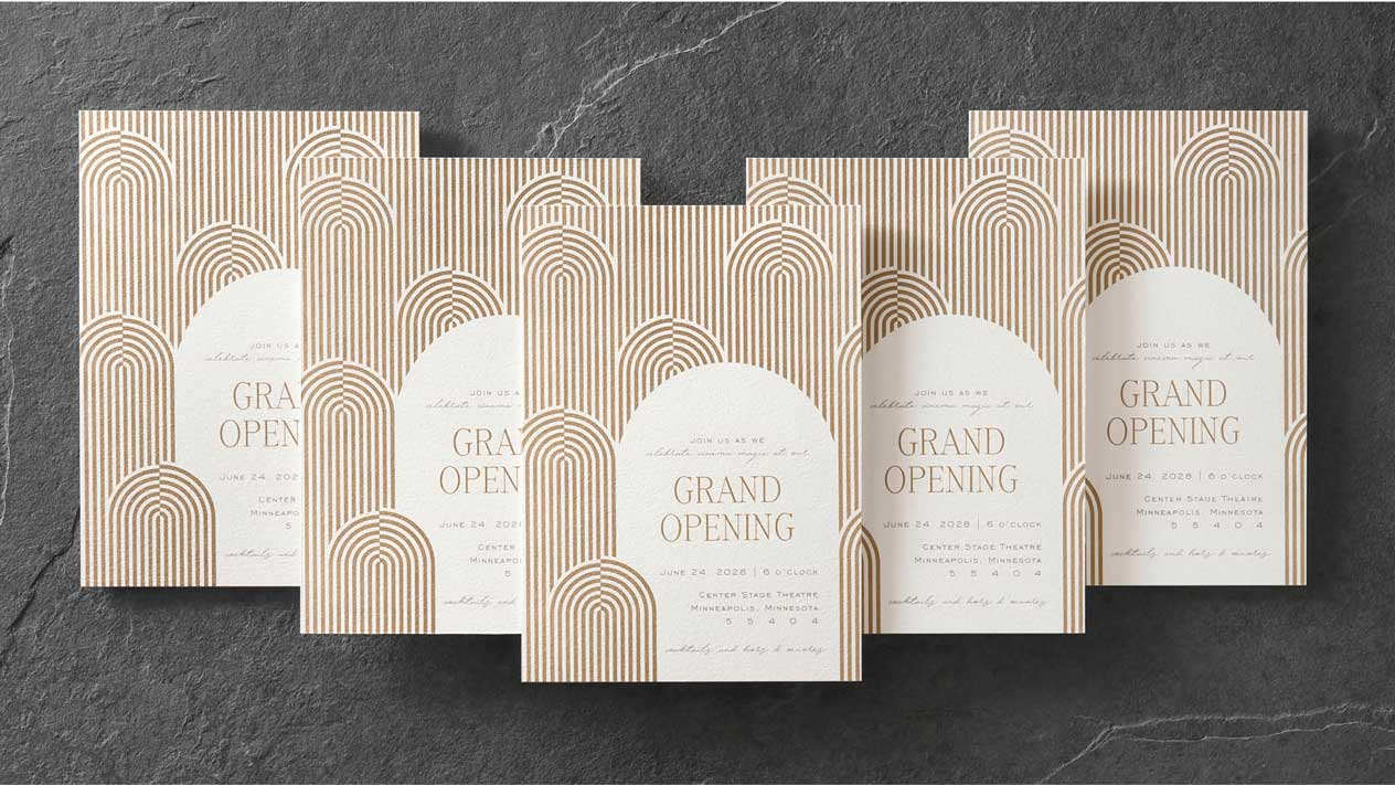 Five custom event invitations with copper thermography printing stacked in a V formation