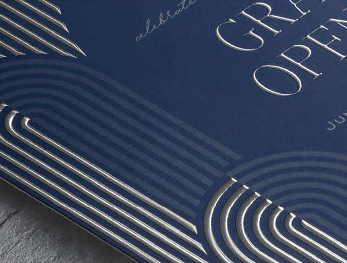 Closeup image of a contemporary arch design in silver enhanced foil on a navy blue custom invitation
