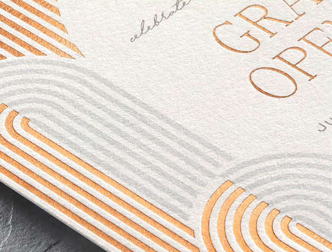 Closeup image of a contemporary arch design in copper foil stamping on a custom invitation