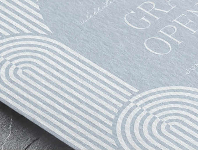 Closeup image of a contemporary arch design in White Ink on a light blue custom invitation