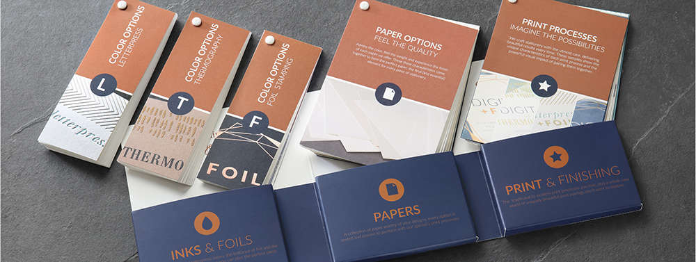 An open designer tool kit showing each swatchbook for color options, paper types and print processes