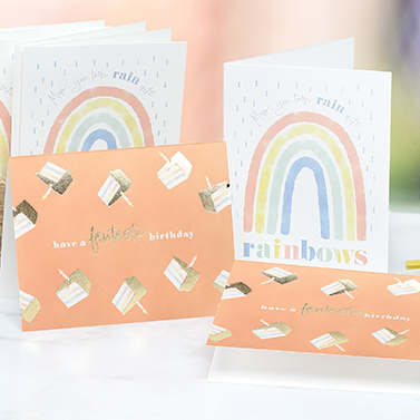 An arrangement of cheerful custom print folded greeting cards for celebrating birthdays