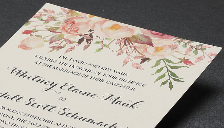 Custom floral wedding invitation with gold foil leaves. 