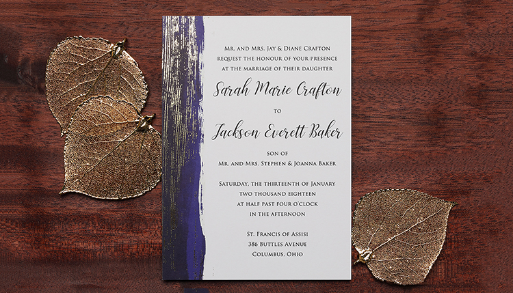 Custom party invitation with brush stroke design in silver foil. 