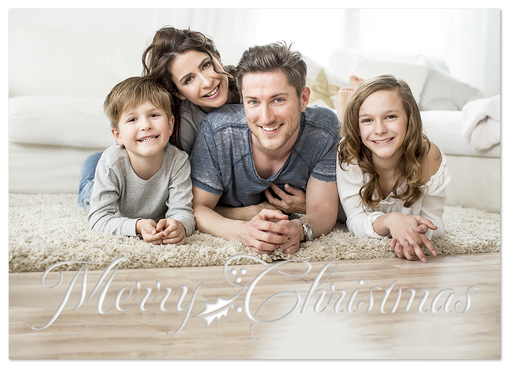 Image of the final Christmas card with family photo and laser cut "Merry Christmas" design. 