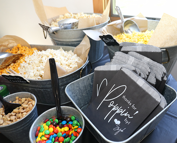 Custom print favor bags in black and white used as treat bags at the graduation party. 