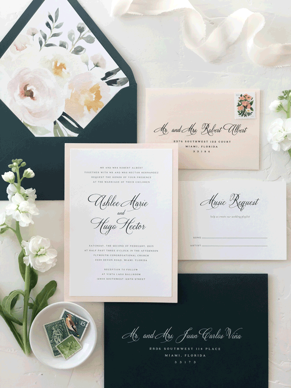 Modern wedding invitation suite with navy envelope and full color floral envelope liner. 