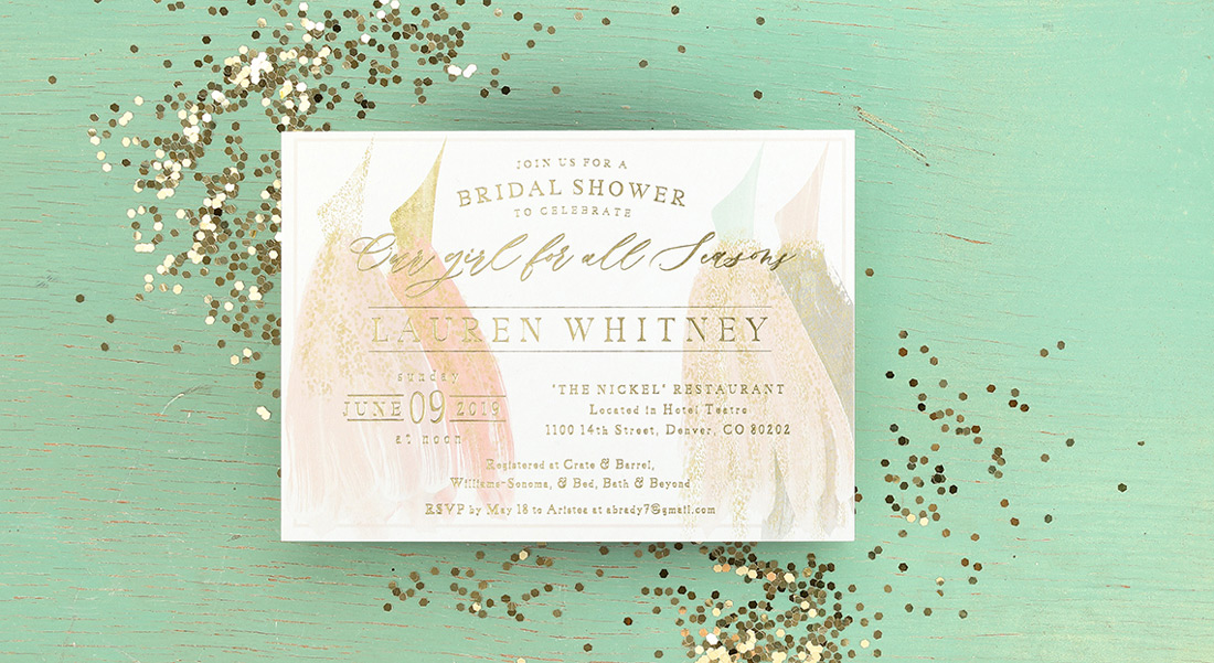 Photograph of Bridal Shower Invitation with watercolor dresses and gold foil stamping. 