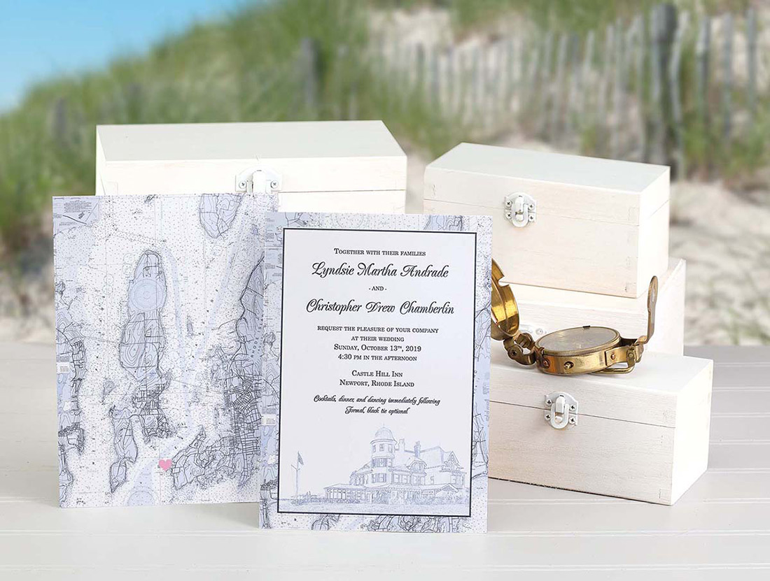 A wedding invitation with venue drawn on the front and topographical map printed on the back. 