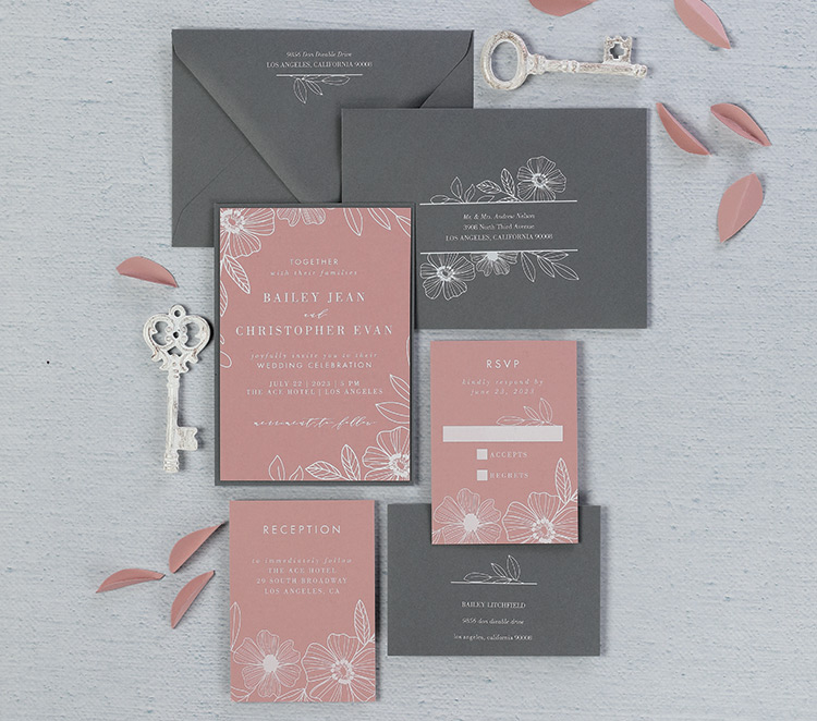 Wedding invitation suite with White printing on gray envelopes and pink flat cards. 