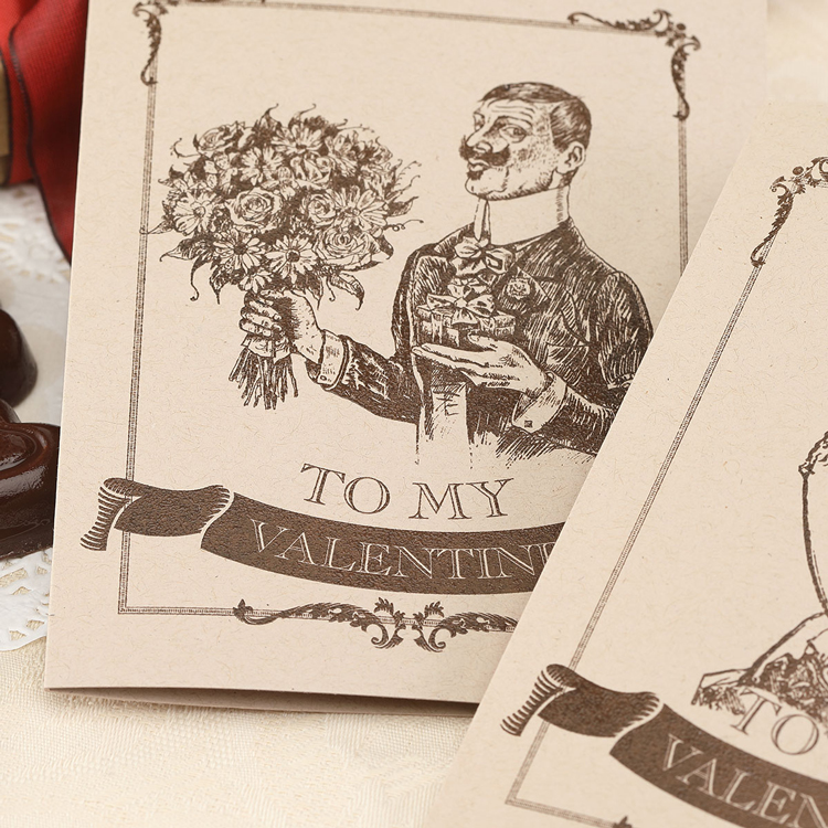 Closeup of a Victorian valentine on a kraft paper folded card with brown thermography printing. 