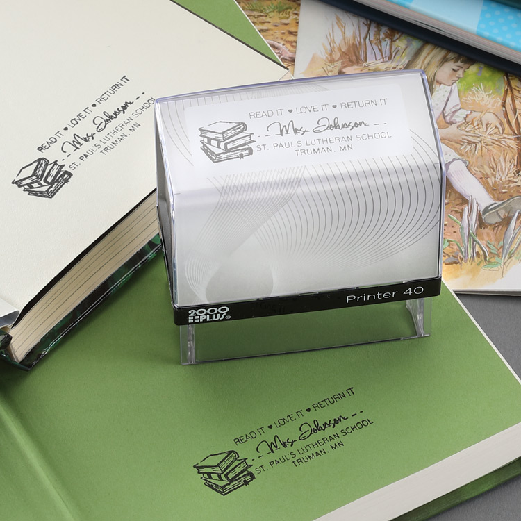 A custom stamp for a librarian is shown being used on library books. 