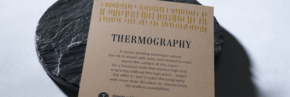 A sample card printed with the definition of thermography in thermography print. 