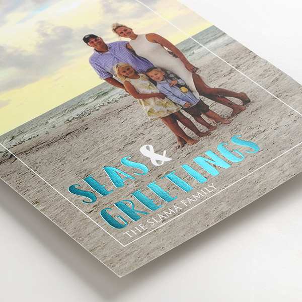 Coated 120 lb. flat card paper option shown with a photo and aqua foil stamping. 