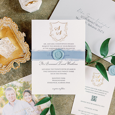 Custom printed wedding invitation with a homemade wax seal.