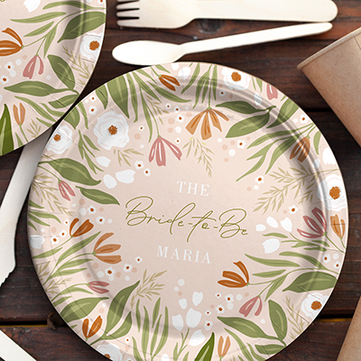 A custom printed paper plate with floral design and "bridal shower" plus bride's name.